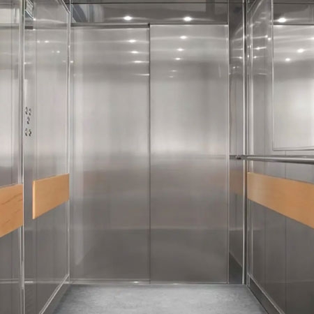 Commercial Stretcher lift with automatic sliding cabin and landing doors, 1000kg load capacity.